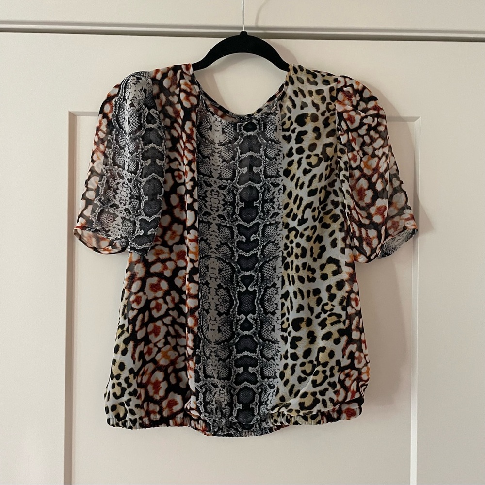 Womens multi-print top with puffed sleeves and black inlay